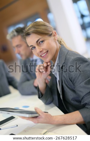 Portrait of executive woman in business meeting