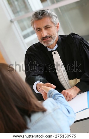 Lawyer meeting client in courthouse office