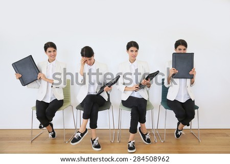 Young woman in waiting room for job interview