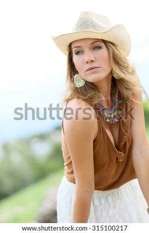 Attractive woman; model with cowgirl style