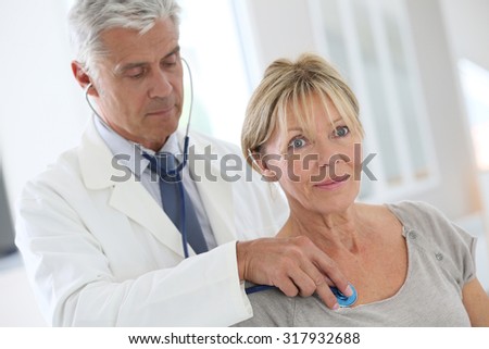 Senior woman in doctor\'s room for consultation
