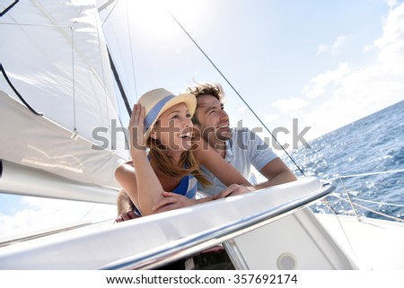 Similar – Image, Stock Photo Traveling woman on boat in sea