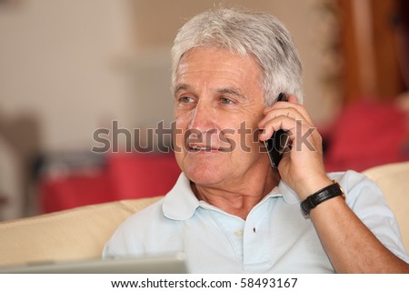 Closeup of senior man talking on mobile phone