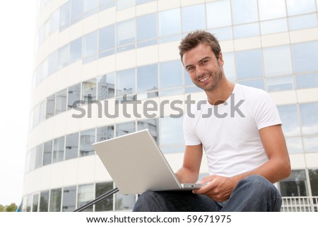 Closeup of college student with laptop computer