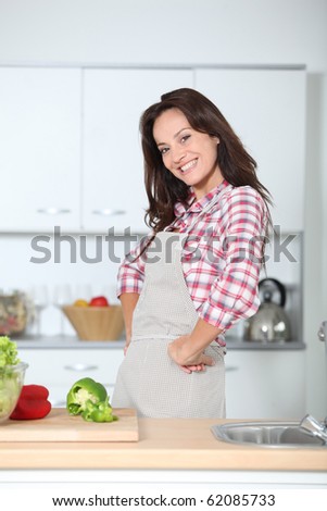 Beautiful woman standing in kitchen