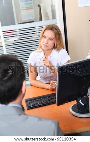 Man meeting financial adviser in office