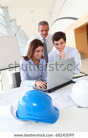 Architects working on construction project in the office
