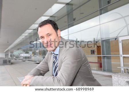 Businessman standing outside congress center