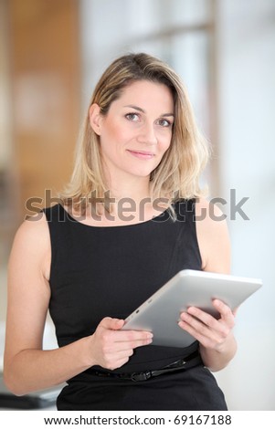 Businesswoman using electronic tab