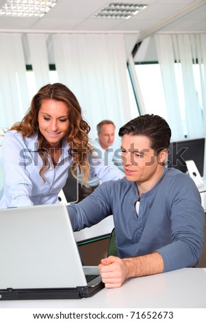Office workers with laptop computer