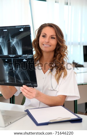 Nurse looking at X-ray in the office