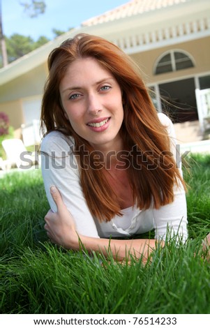 Beautiful woman laying down home garden