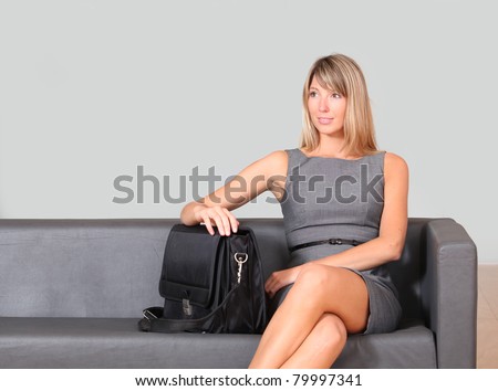 Businesswoman sitting in airport waiting room