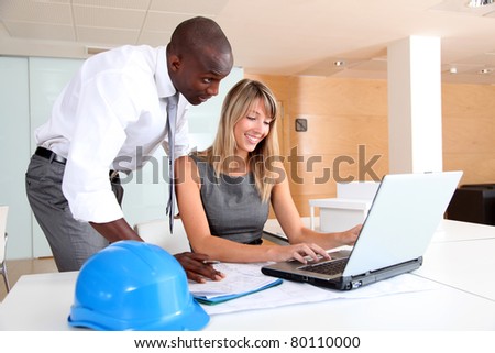 Architects working on laptop computer