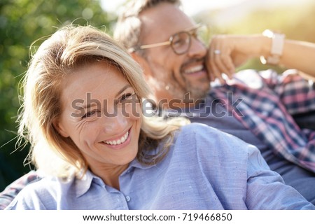 Similar – Image, Stock Photo Cheerful mature couple in stylish outfits in city