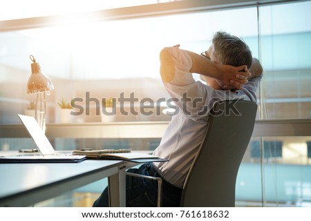 Businessman in office relaxing in chair Stock foto © 