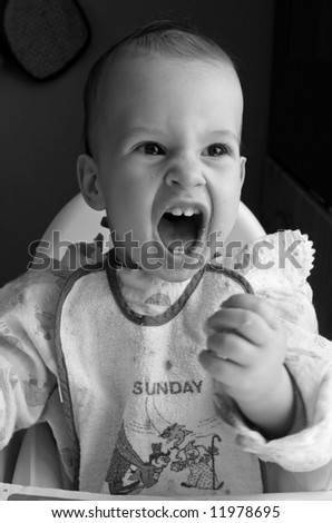 one year old boy feel victory over his food (after dinner)