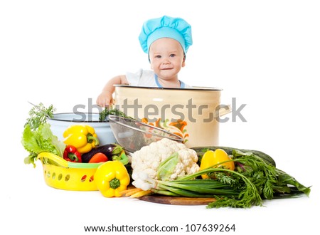 Baby Chef and vegetables, white background