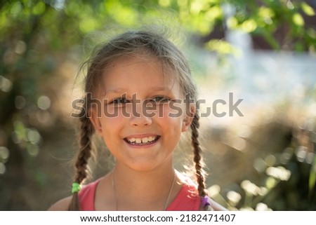 Similar – Image, Stock Photo Little girl, eight years old, sitting on the grass outdoors.