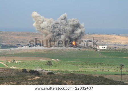 fire and smoke of explosion in Gaza. morning light.