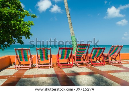 Beach chairs overlooking the calm ocean\
Providence Island, Colombia
