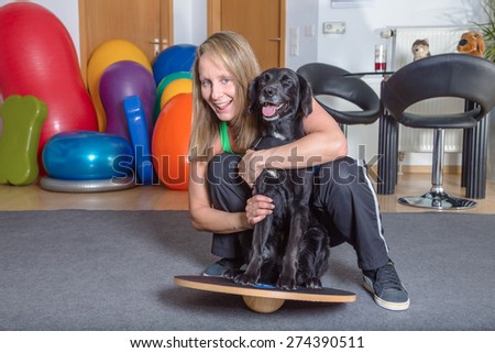 woman hugging dog