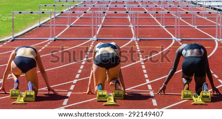 hurdle runners in start position