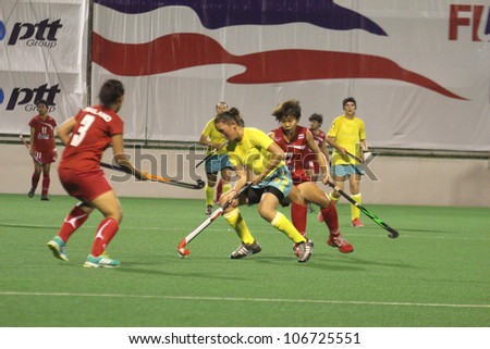 PATHUMTHANI,THAILAND - JUNE 27 : Unidentified player in Women\'s Junior PTT Asia Cup 2012 Between Thailand (R) vs Kazakhstan (Y) on June 27, 2012 at National Hockey Center in Pathumthani,Thailand