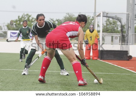 PATHUMTHANI,THAILAND - JUNE 27 : Unidentified player in Women\'s Junior PTT Asia Cup 2012 Between Japan (R) vs Pakistan (G) on June 27, 2012 at National Hockey Training Center in Pathumthani,Thailand