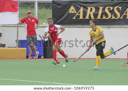 PATHUMTHANI,THAILAND - JUNE 27 : Unidentified player in Women\'s Junior PTT Asia Cup 2012 Between Malaysia (Y) VS Singapore (R) on June 27, 2012 in Pathumthani,Thailand