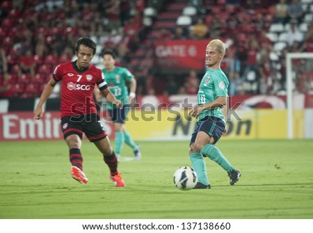 BANGKOK, THAILAND- MAY 1 : Marcio Richardes (r) in action during AFC Champions League 2013 Between Muangthong Utd (R) Vs Urawa red Diamonds(G) on May 1, 2013 at SCG Stadium, Bangkok, Thailand