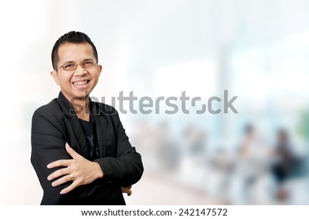Portrait of young asia businessman in office
