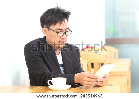 image of a asia businessman in a coffee shop