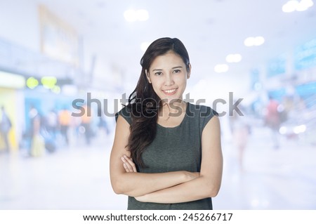 portrait of asian businesswomen has airport background ..Mixed Asian / Caucasian businesswoman.Positive emotion