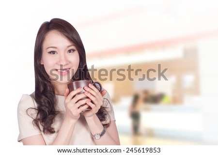 Portrait of young asia business woman 20 - 30 year old in her office.Mixed Asian / Caucasian businesswoman.