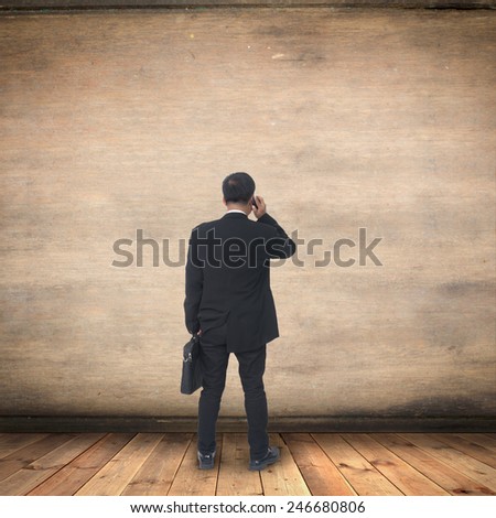 Portrait of young asia businessman has office background .cross one\'s arm,Positive emotion