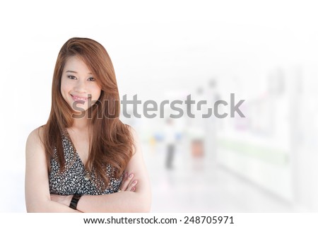 Portrait of young asia business woman 20 -30 year hold banner old in her office. Mixed Asian / Caucasian businesswoman. Positive emotion