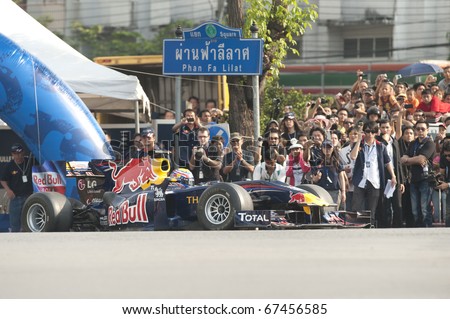 BANGKOK,THAILAND - DECEMBER 18: Mark Webber of Red Bull Racing Team speeding show on Street of Kings, Ratchadamnoen Red Bull Bangkok 2010 ,December 18, 2010 in Bangkok,Thailand