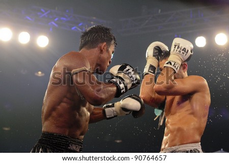 BANGKOK, THAILAND- NOV 27 : Unidentified boxers compete in Thai Fight:Muay Thai. World's Unrivalled Fight on November 27, 2011 at Convention Hall, Imperial World Samrong, Samutprakan, Thailand
