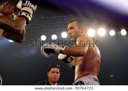 BANGKOK, THAILAND- NOV 27 : Unidentified boxers compete in Thai Fight:Muay Thai. World\'s Unrivalled Fight on November 27, 2011 at Convention Hall, Imperial World Samrong, Samutprakan, Thailand