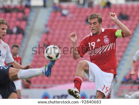 BANGKOK THAILAND - JANUARY 15 : P.Jakob (R) in action during KING\'S CUP 2012 between Denmark vs Norway on January 15, 2012 in Rajamangla Stadium,Bangkok, Thailand.