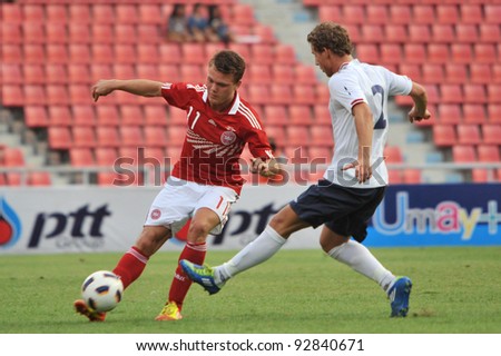 BANGKOK THAILAND - JANUARY 15 : L.Emil (L) in action during KING\'S CUP 2012 between Denmark vs Norway on January 15, 2012 in Rajamangla Stadium,Bangkok, Thailand.