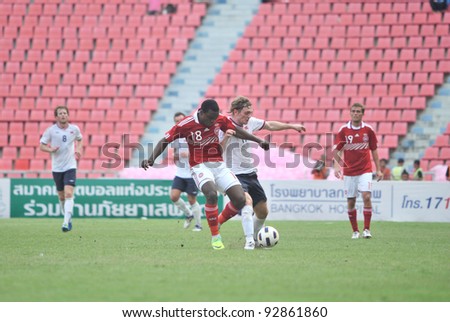 BANGKOK THAILAND - JANUARY 15 : T.Sorum (R) in action during KING\'S CUP 2012 between Denmark vs Norway on January 15, 2012 in Rajamangla Stadium,Bangkok, Thailand.