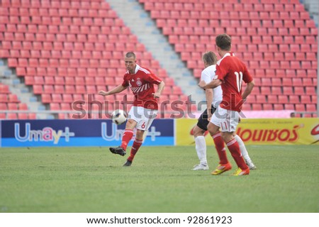 BANGKOK THAILAND - JANUARY 15 : F.Dennis (L) in action during KING\'S CUP 2012 between Denmark vs Norway on January 15, 2012 in Rajamangla Stadium,Bangkok, Thailand.