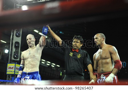 BANGKOK, THAILAND- MARCH 22 : Abduvakhob Sharipov (red) VS Ritsihard Jocr (Blue) in World Amateur Muaythai Champioships 2012. on March 22, 2012 at National Stadium, Bangkok, Thailand