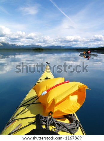 Two sea kayaks on Atlin Lake in B.C. (Canada)