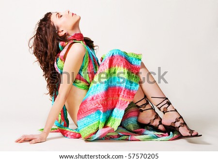 Portrait of a beautiful brunette in colorful sundress