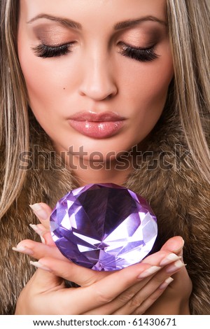 Closeup portrait of a beautiful woman with precious jewel