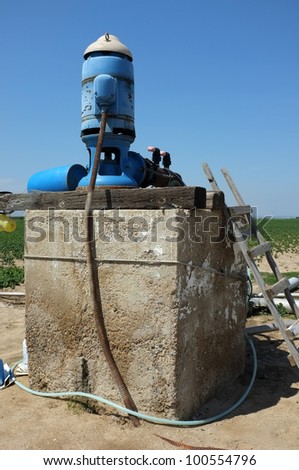 An irrigation pump delivers water to a Central California farm field