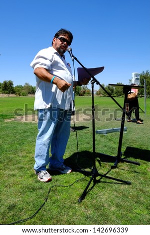 BAKERSFIELD, CA-JUN 15: Roberto De La Cruz speaks to the crowd before the march to Congressman Kevin McCarthy\'s office in support of a new immigration law on June 15, 2013, in Bakersfield, California.